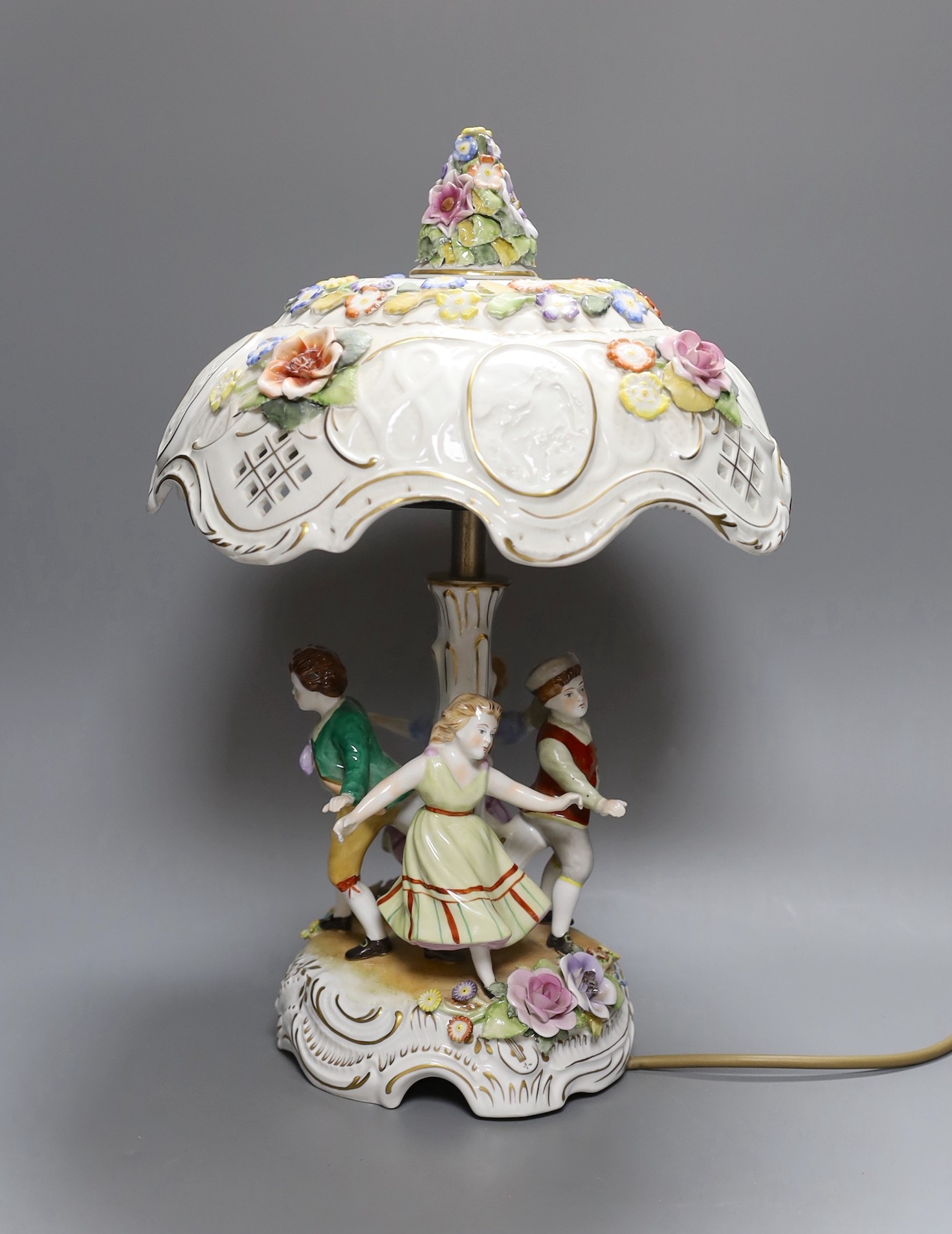A German porcelain figural lamp with lithophane shade, 40cm